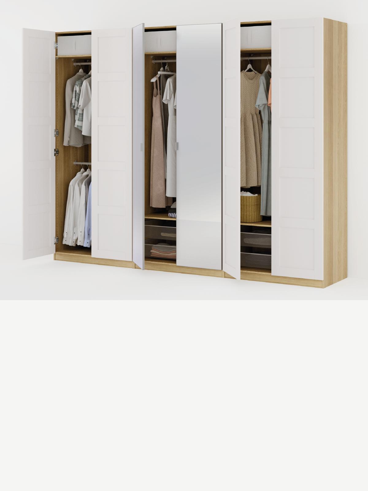 Composizione armadi PAX con ante a battente bianche.