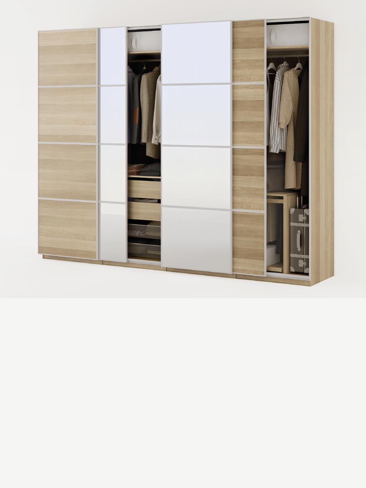 Composizione armadi PAX con ante scorrevoli beige e bianche, visibili in parte accessori KOMPLEMENT interni.