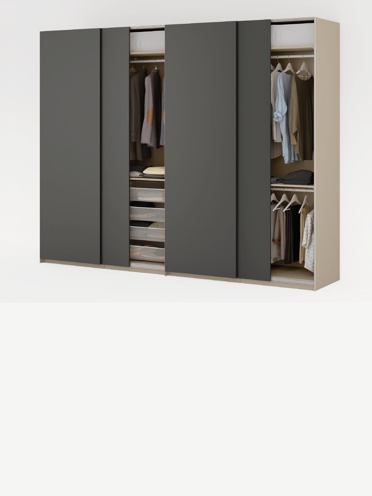 Composizione armadi PAX con ante scorrevoli scure visibili in parte accessori KOMPLEMENT interni.