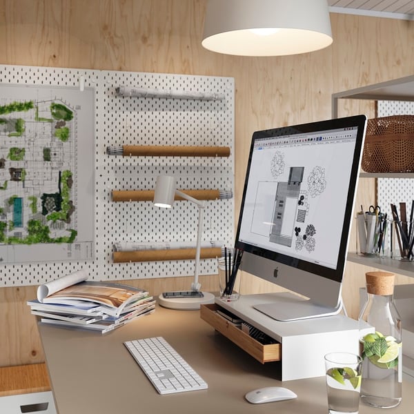 Computer on a stand with planning program open