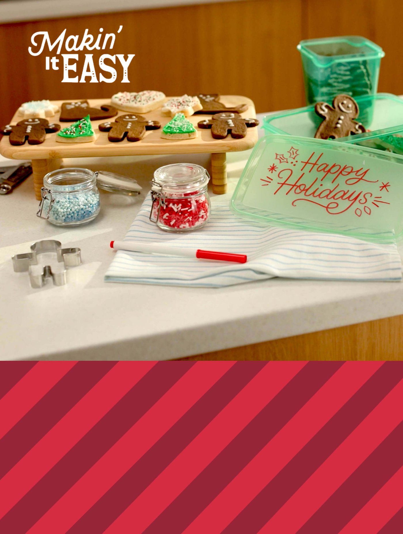 Counter with gingerbread cookies, sprinkles, cutters, and a container reading “Happy Holidays”; text says “Makin’ It EASY.”