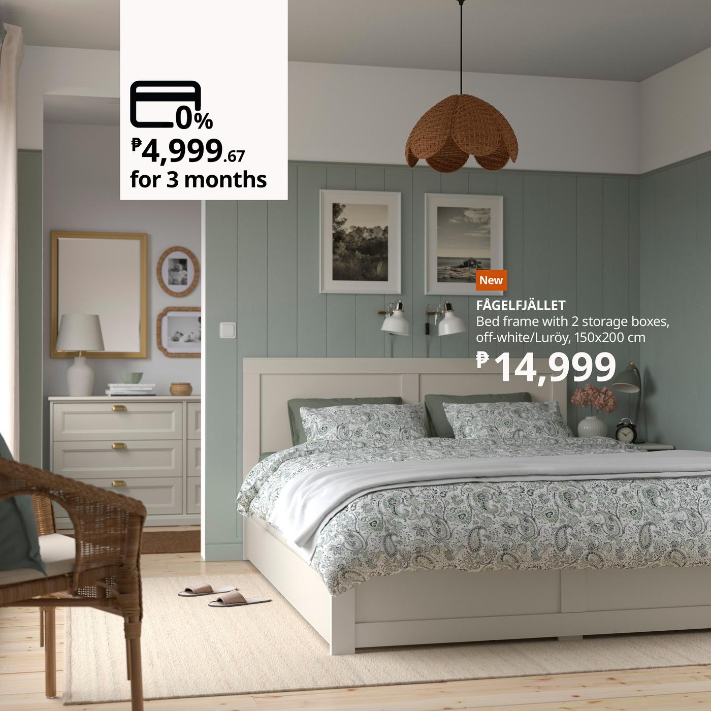 Cozy bedroom scene with a green accent wall, white framed bed, patterned bedding, and wicker pendant light. Price overlay for a bed frame offer.