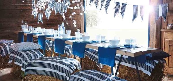 create-a-blue-table-setting-for-a-party-with-nautical-stripes-and-bunting