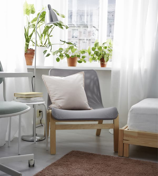 Create a comfortable area to relax with an easy chair, a reading lamp, and some plants.