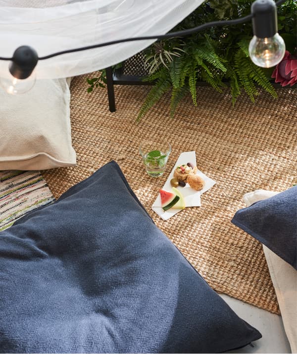 Create a cosy atmosphere and eat sitting on the floor! Use a few comfy cushions with pretty covers, such as IKEA JOFRID cushion cover in dark blue-grey!
