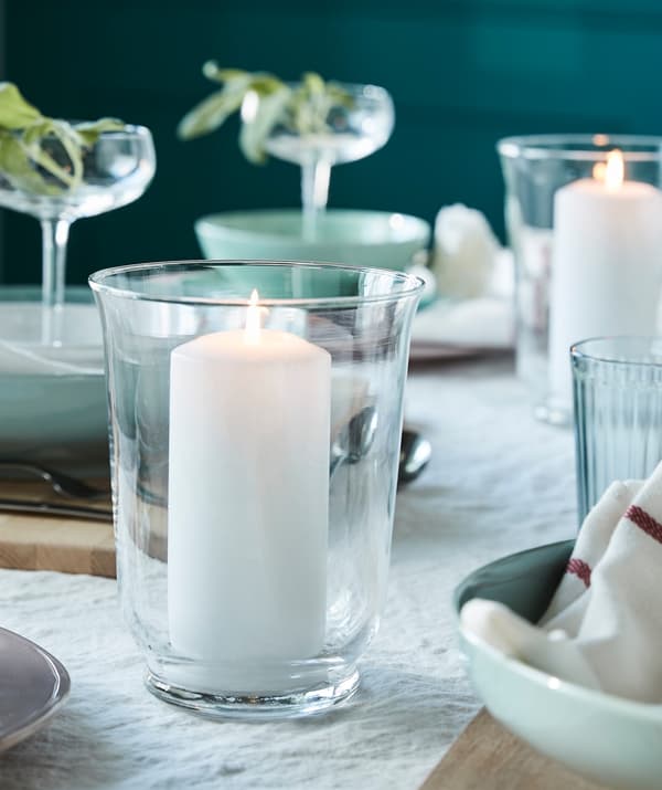 Create a cosy atmosphere at your dinner table! Place IKEA FENOMEN white unscented block candle inside a minimalistic lantern!