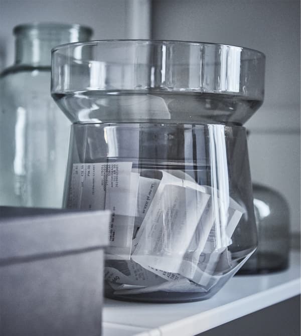 Create a modern home workspace in your living room without hiding every boring office thing away. Just put your receipts in a beautiful vase, such as IKEA PS 2017 transparent glass vase in grey. The set of three can also be stacked for storage.