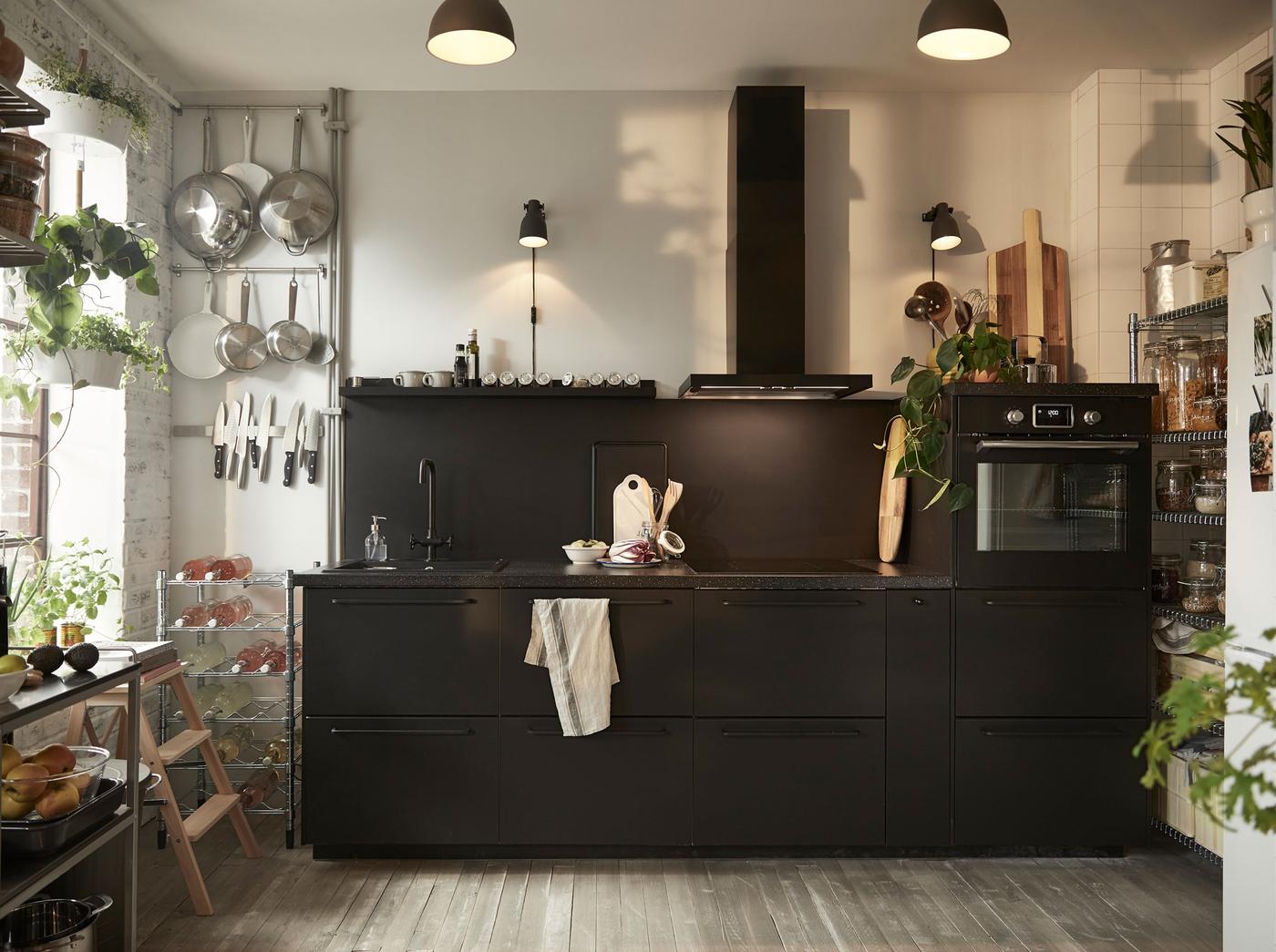Create a more conscious kitchen with black IKEA KUNGSBACKA kitchen cabinet door fronts, which are made out of recycled plastic bottles and wood.