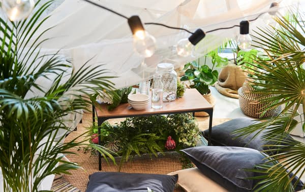 Create a summer picnic indoors. Gather together some friends around a coffee table and let them sit on a cosy rug. IKEA has several coffee tables such as IKEA FJÄLLBO coffee table in black metal and solid wood.