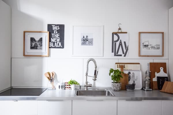 Create an easy-change wall display using hangers.
