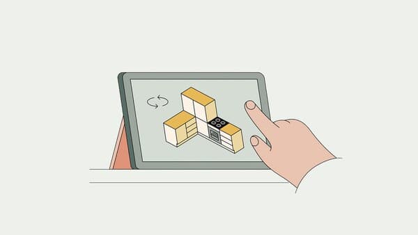 Croquis d'une main faisant une conception de cuisine sur une tablette