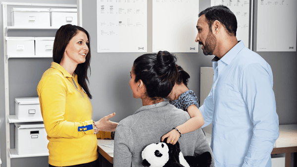 Customer representative helping a family - IKEA Customer Service