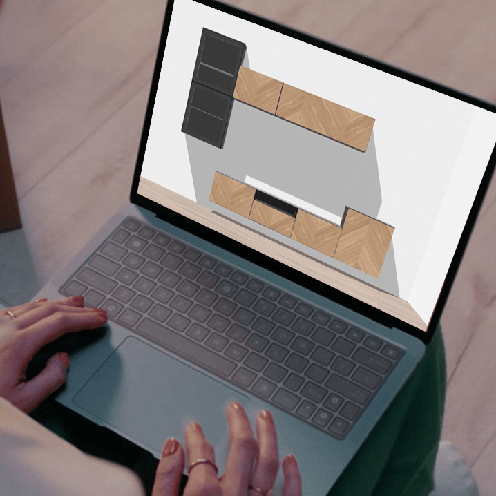 Customer with laptop on knees using BESTA planner.