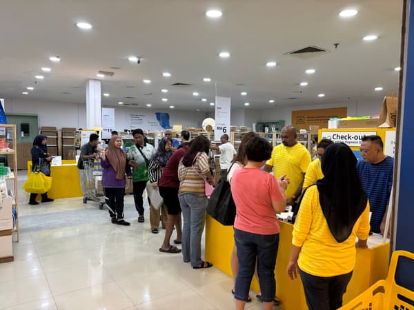 Customers queuing up to pay for their items