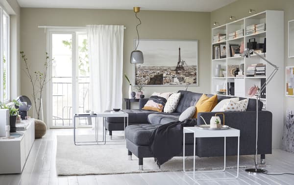 IKEA LANDSKRONA dark gunnared grey sofa seats five with two long lounge chaises. Steel chrome-plated legs add a modern touch to a living room.
