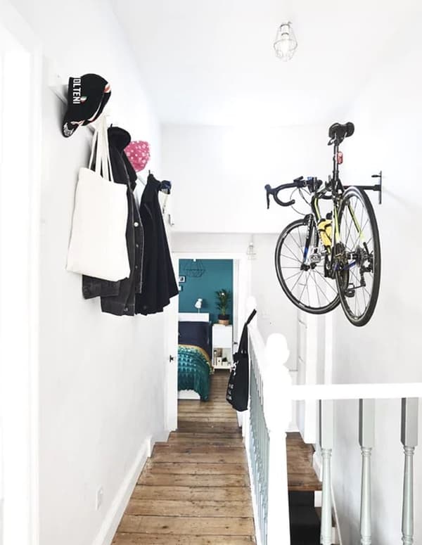 Decorate a narrow hallway by making use of the space behind the door