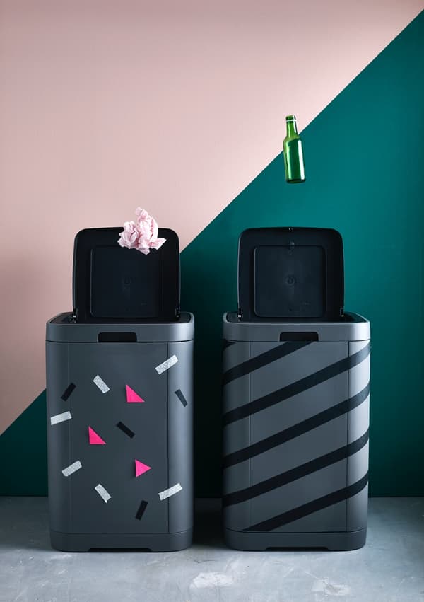 Decorated black dustbins for recycling.