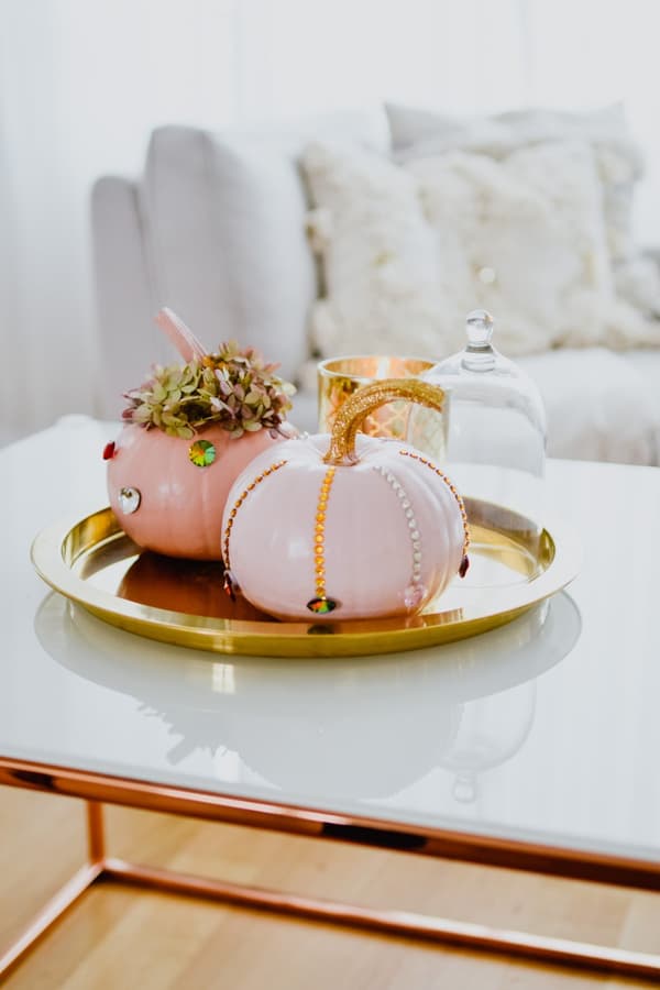 Decorated pumpkins on a gold plate