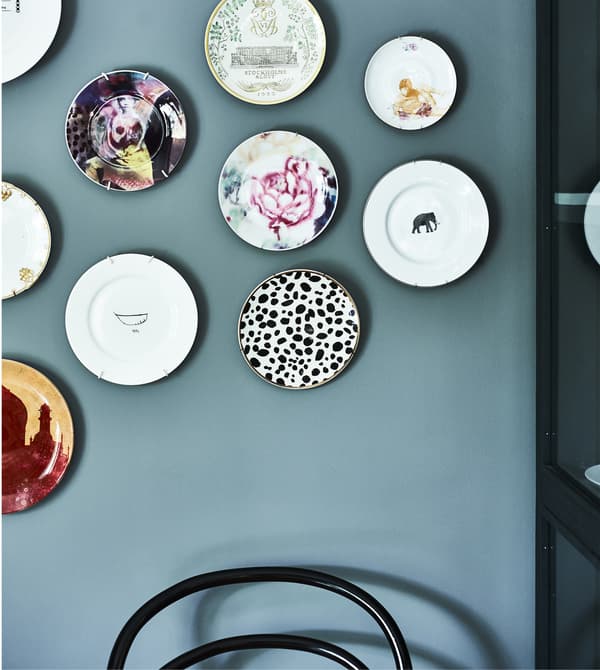 Decorative plates hung on a wall.