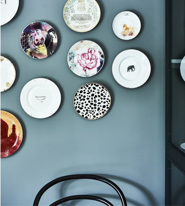 Decorative plates hung on a wall.
