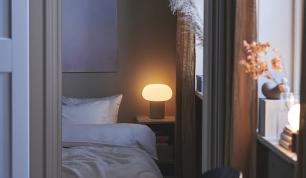 DEJSA table lamp in bedroom