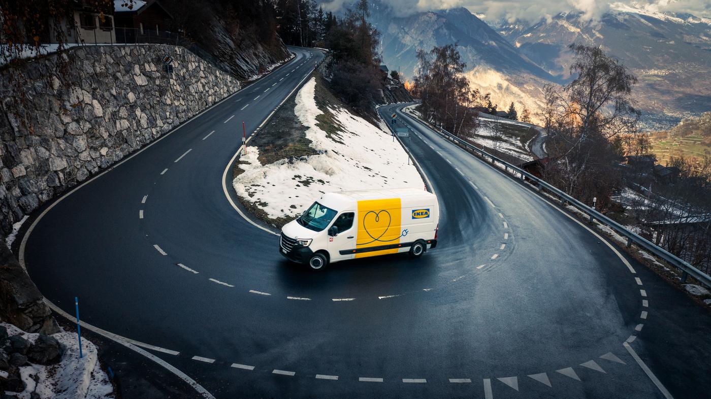 Delivery van on snowy mountain road