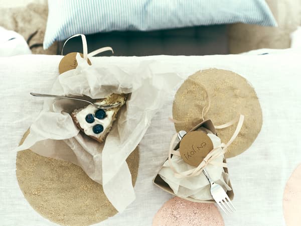 Desserts are served in small paper containers.