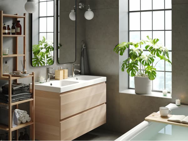 Detail of a modern bathroom with wooden furniture.
