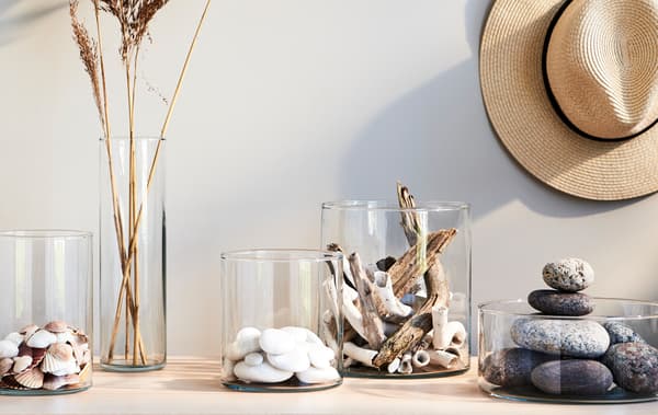 Devote a corner of your home to savour the memories and joys of warm, sunny days. CYLINDER glass vases both hold your shells, pebbles and straws separate – and visually bind them together.