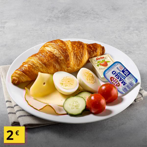 Dish at the Swedish Restaurant: Breakfast plate. Cherry tomatoes, cucumber, cheese, smoked ham, boiled egg, croissant, butter and jam​, 2€