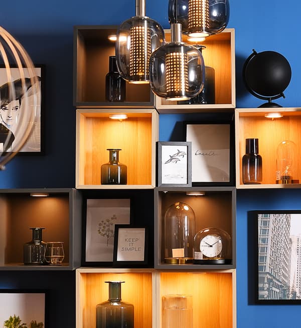 Display shelves hung on a wall featuring glasses.