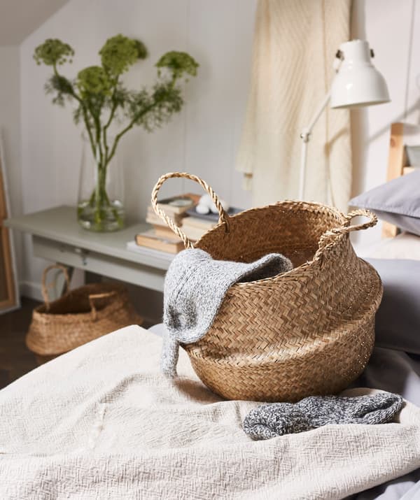 Do you easily get cold during the night? Keep a basket beside your bed with some warm throws. IKEA FLÅDIS basket in renewable seagrass is perfect for storing your bed necessities!