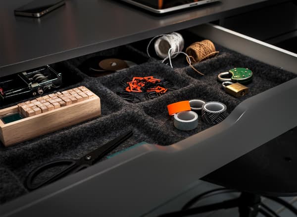 Drawer inserts containing twine, tape and othr useful items.