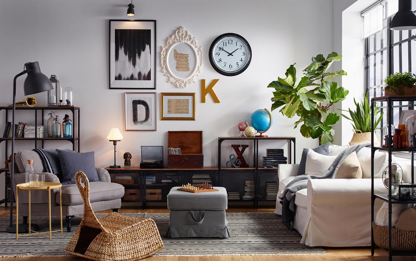 Eclectic living room with gallery wall and industrial style wood and metal shelving.