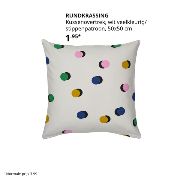 Een wit kussen met gekleurde stippen.