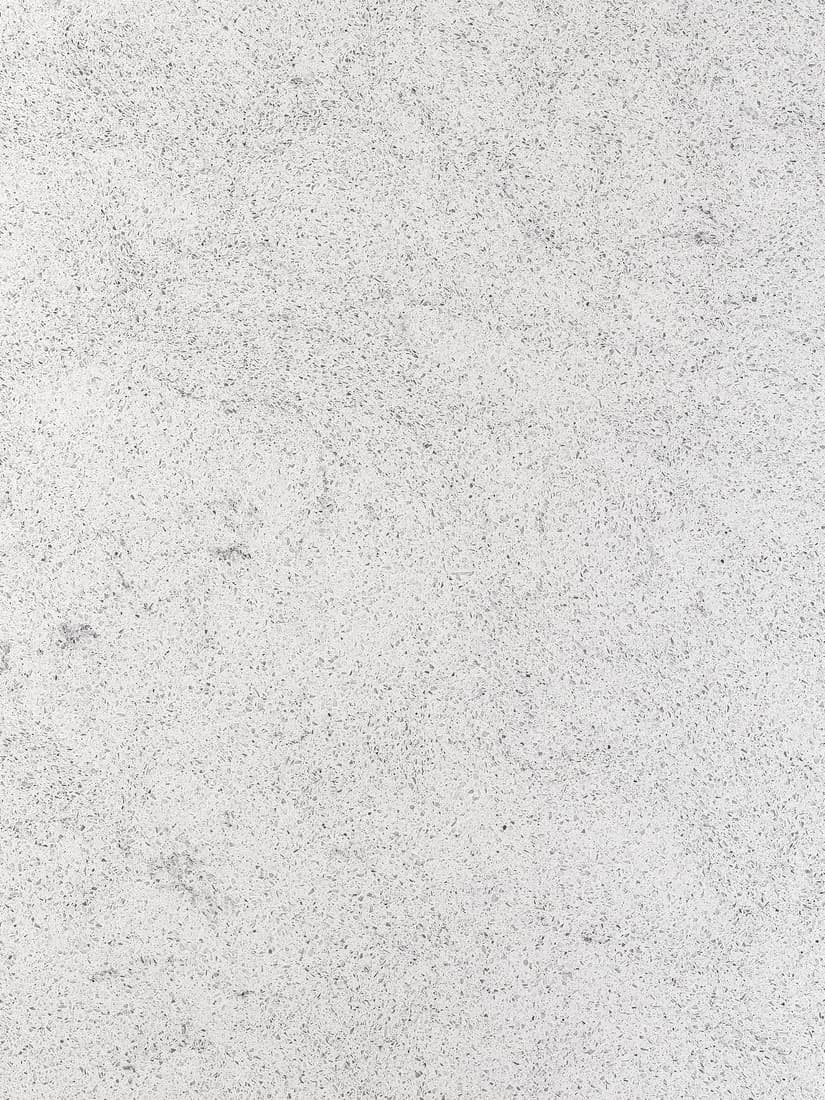 Eine LOCKEBO Glaskomposit Maßarbeitsplatte in glänzend weiß grauem Steinmuster