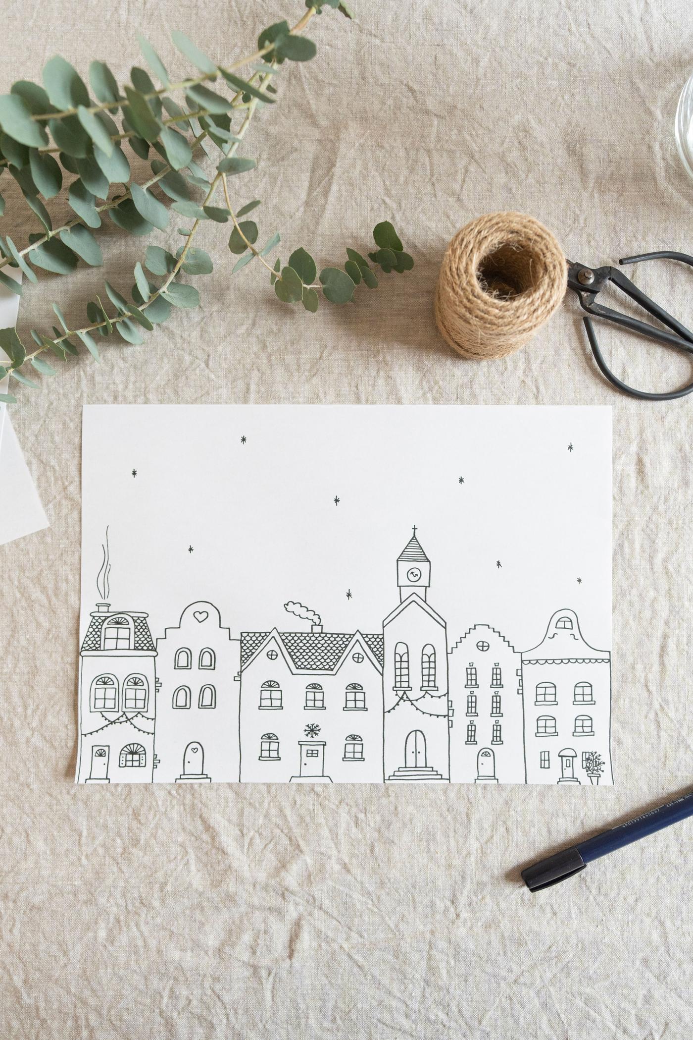 Eine Malvorlage für die selbstbemalten Vorratsgläser EKLATANT. Die Malvorlage zeigt eine winterliche Häuserfront.