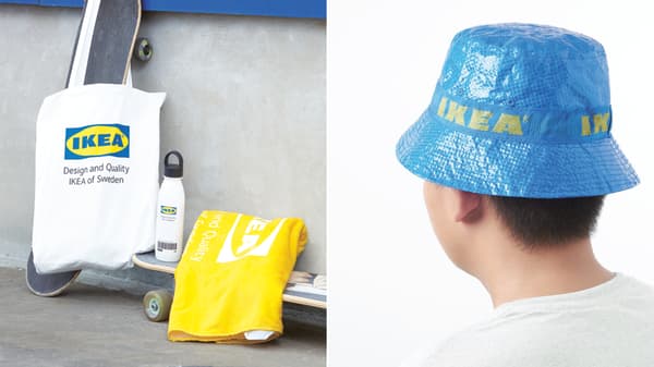 Eine Stofftasche und ein Badetuch mit IKEA Logo. Ein Hut aus der FRAKTA Tasche von IKEA.