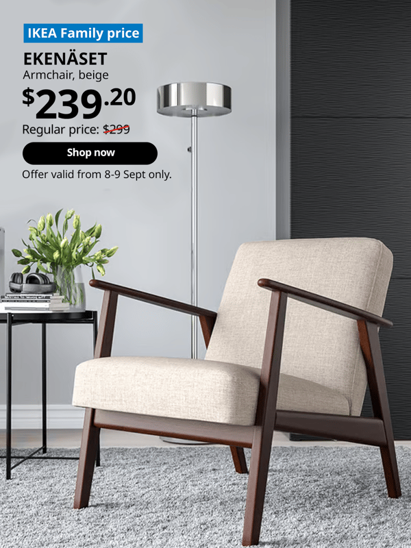 EKENASET arm chair in a living room setting infront of a standing floor lamp on a grey carpets. Words on image read "IKEA Family Price, EKENASET, Armchair, beige, $239.20, Regular price, $299 with a slash, Offer valid from 8-9 Sept only"