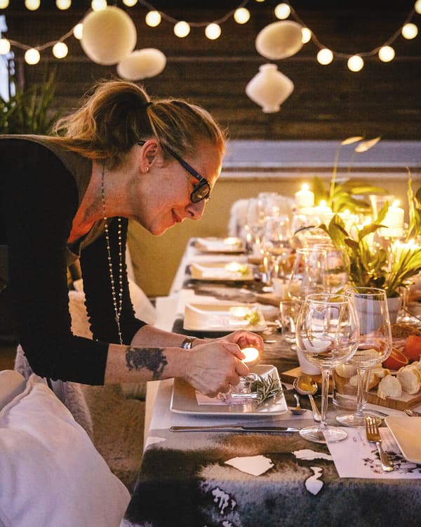 Elisabetta adds the finishing touches to her table setting.
