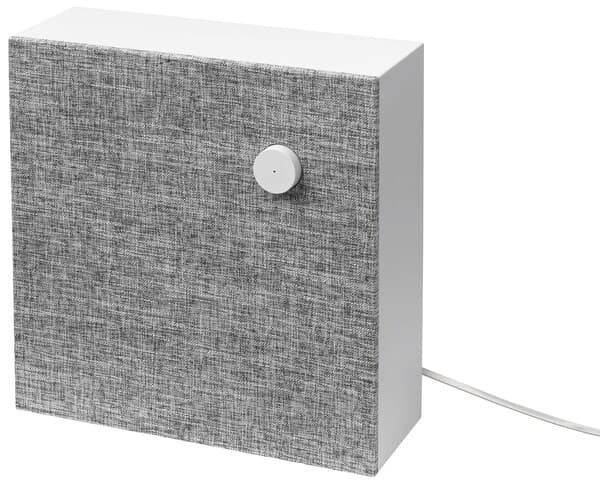 ENEBY Bluetooth speaker wall mounted against a gray painted wall.