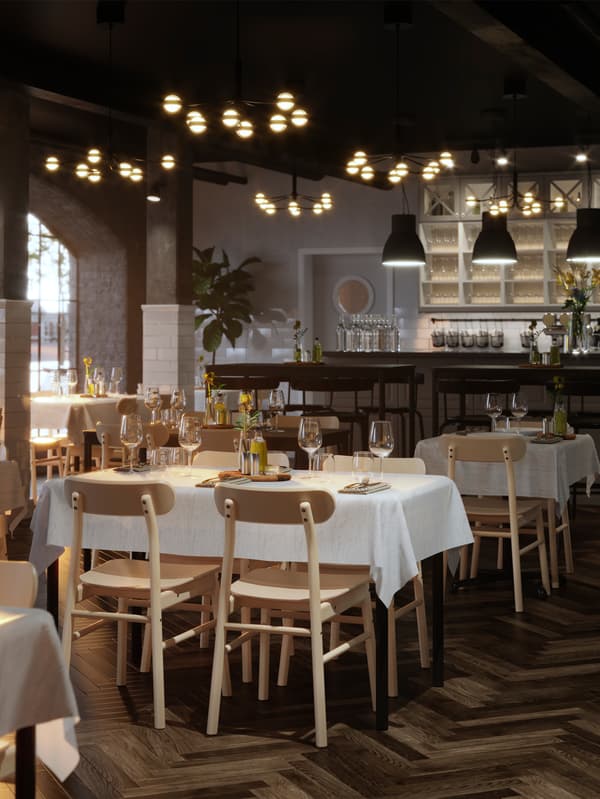 Es ist ein Restaurant mit gedeckten TOMMARYD Tischen mit weissen Tischdecken, STORSINT Weingläsern und Blumen zu sehen.