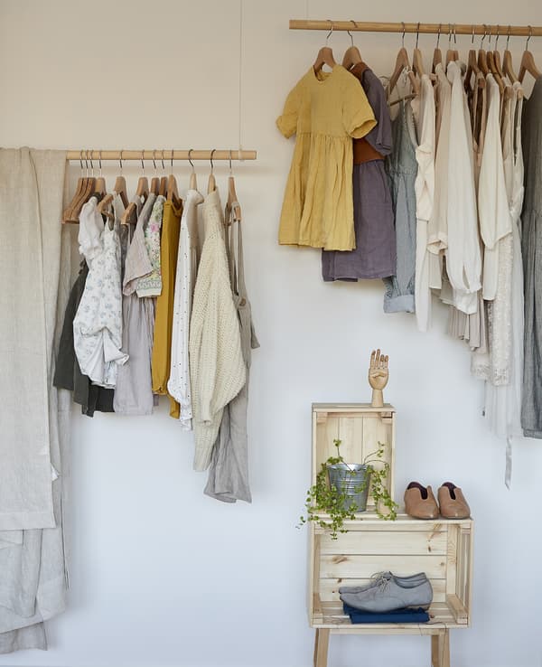 Eva and Marla’s clothes stored on open rails.
