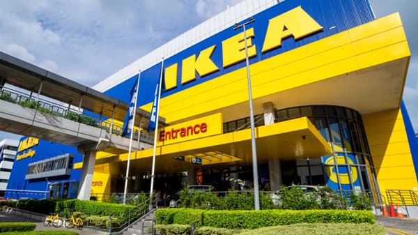 Exterior of IKEA Alexandra store, which is decked in blue and yellow. The IKEA logo in yellow is against the blue wall.