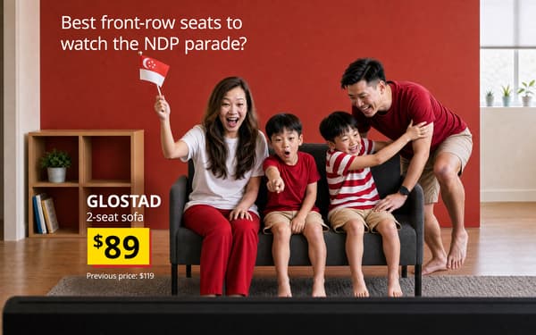 Family cheering together on a GLOSTAD sofa while watching the National Day Parade at home. 
