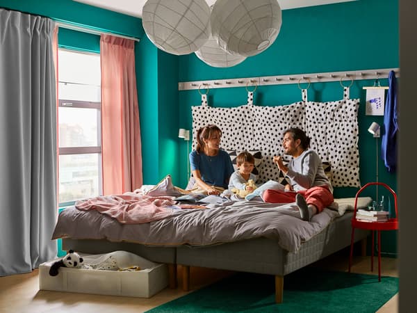 Family enjoying their bonding time on a SKÅRER sprung mattress.
