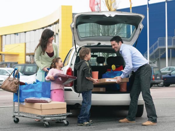 Family packing items into the car