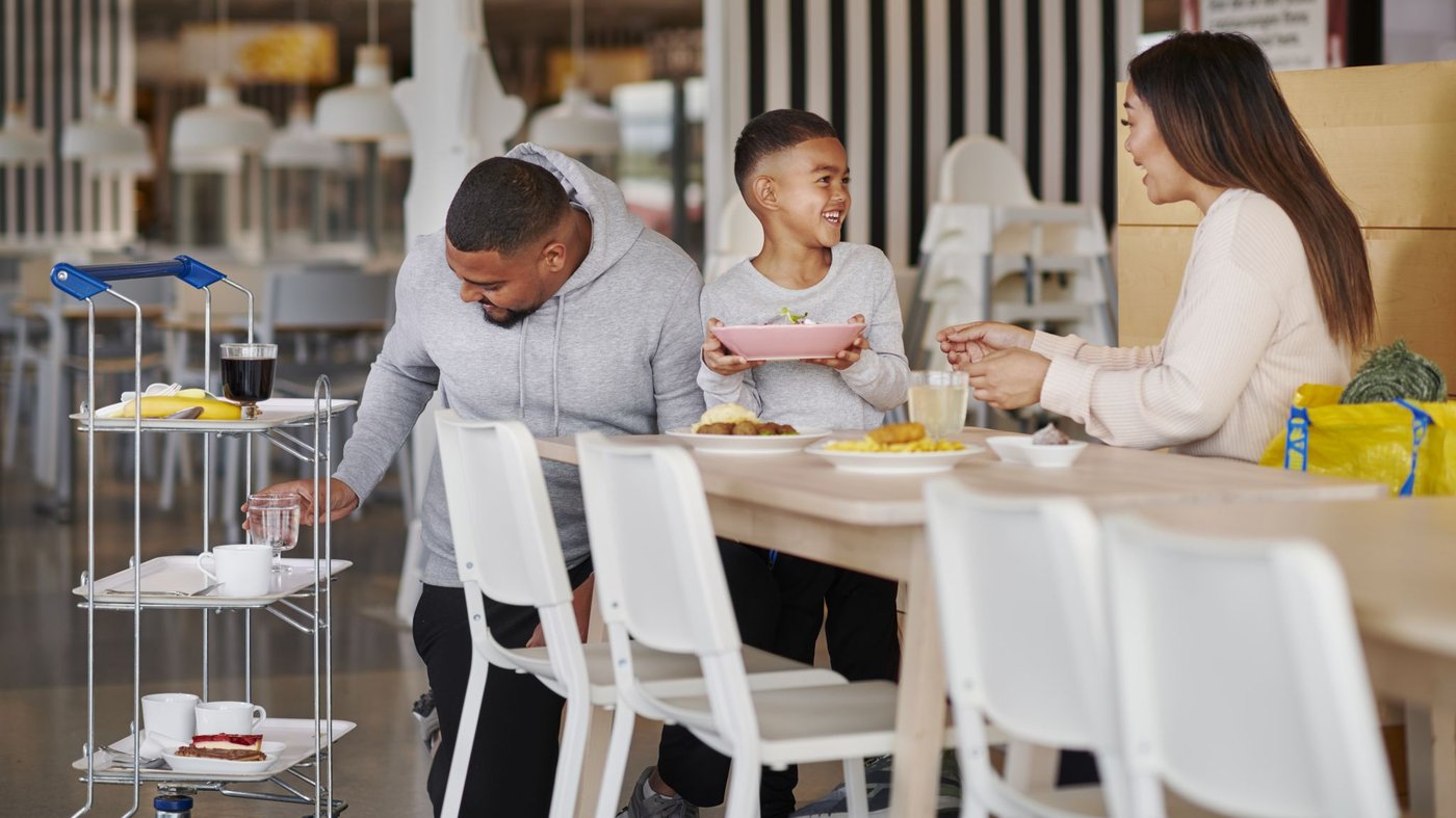 Family sitting together in an IKEA Swedish restaurant