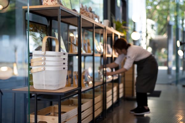 female worker stacks shelves