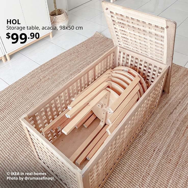 Few KYRRE birch stools stacked together sideways in a HOL storage table in a Singapore home.